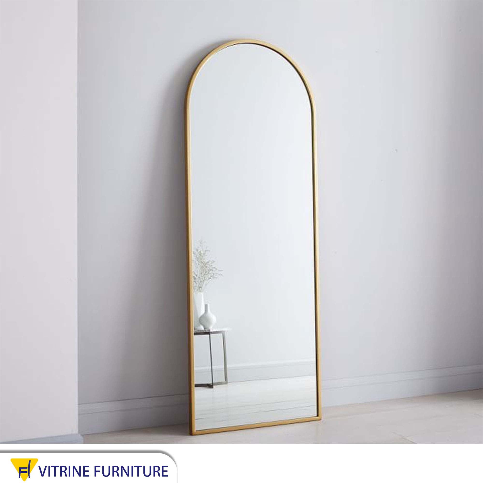 Modern mirror with a thin gold frame
