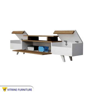 TV unit with movable hinged surfaces