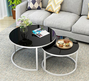 Two circular tables in black and white