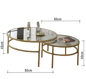 Two circular tables in golden color