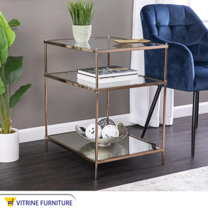 Side table with three transparent glass surfaces
