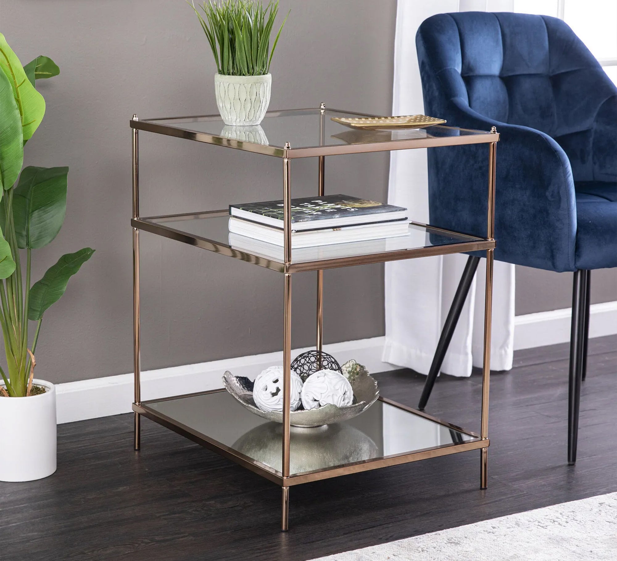 Side table with three transparent glass surfaces