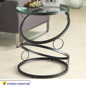 A black circular table with a unique design