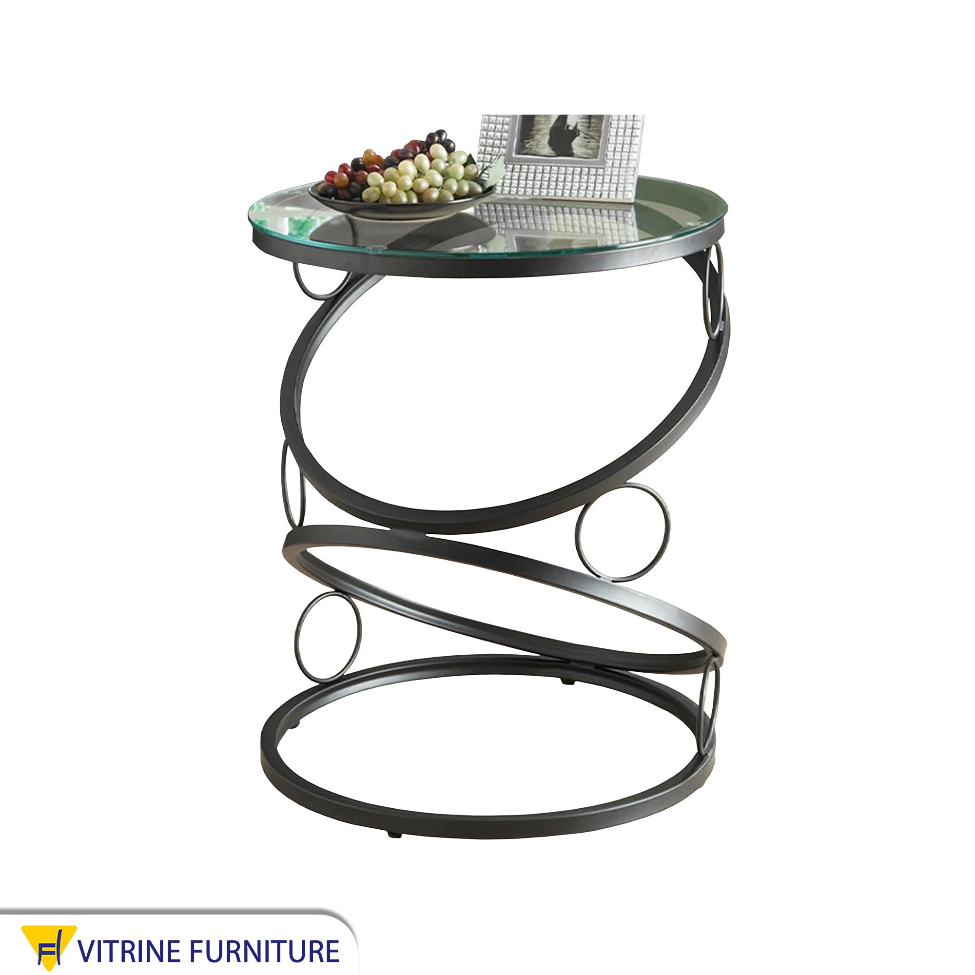 طاولة دائرية باللون الأسود ذات تصميم فريد