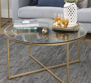 Circular table with a gold x-shaped base