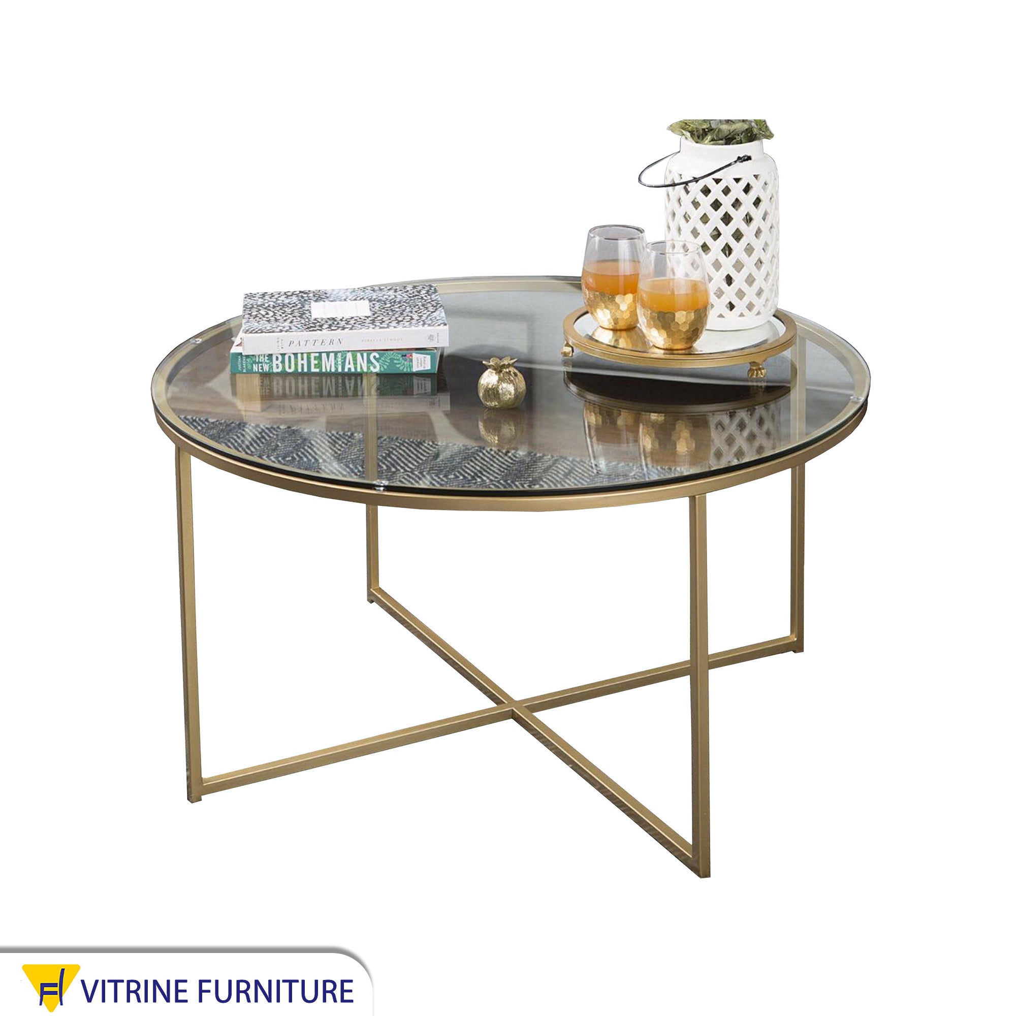 Circular table with a gold x-shaped base