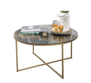 Circular table with a gold x-shaped base