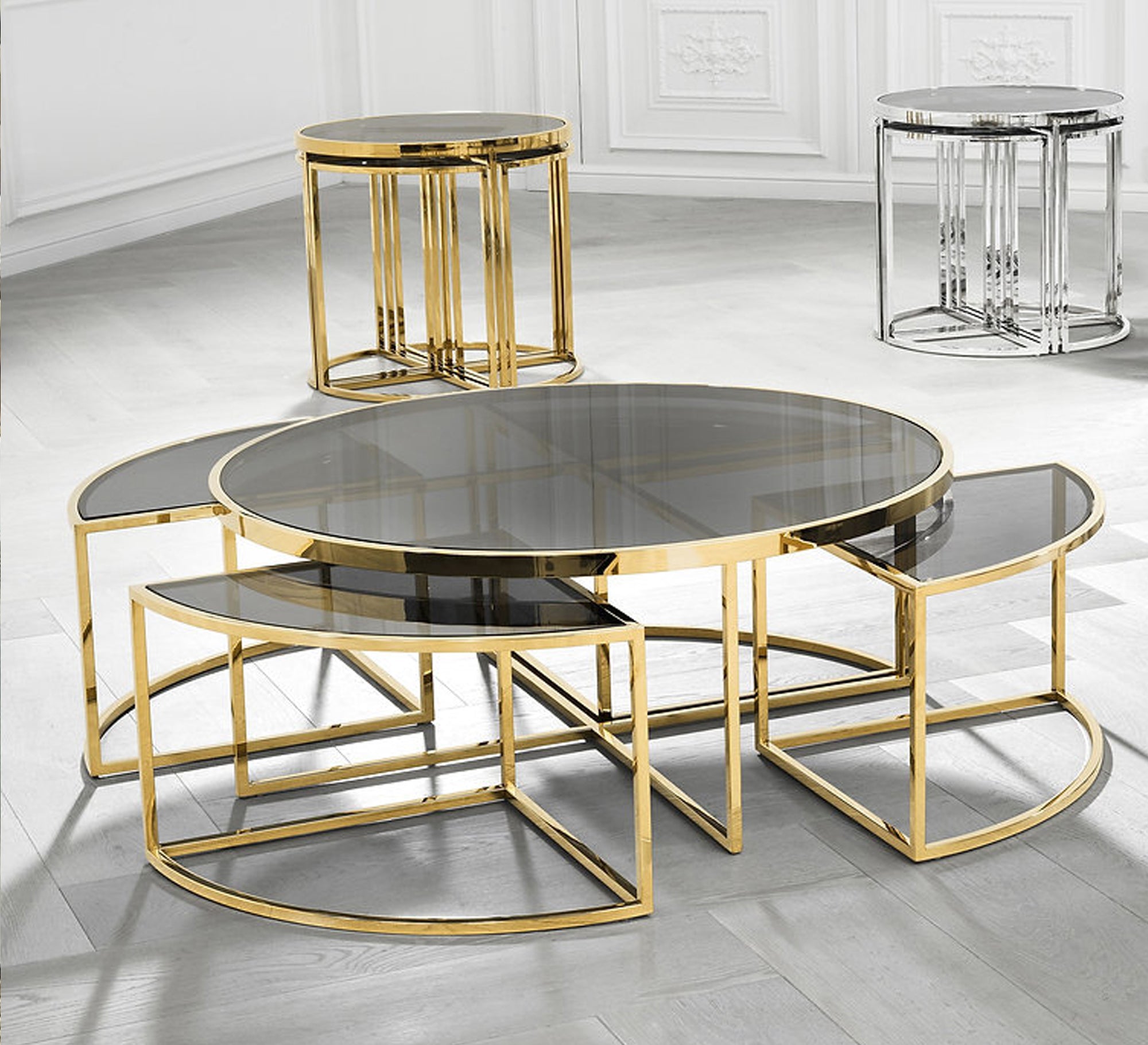 A set of tables with a modern design in golden color