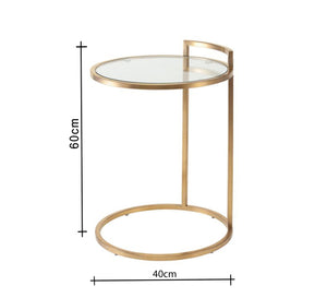 Side table with a circular structure in gold