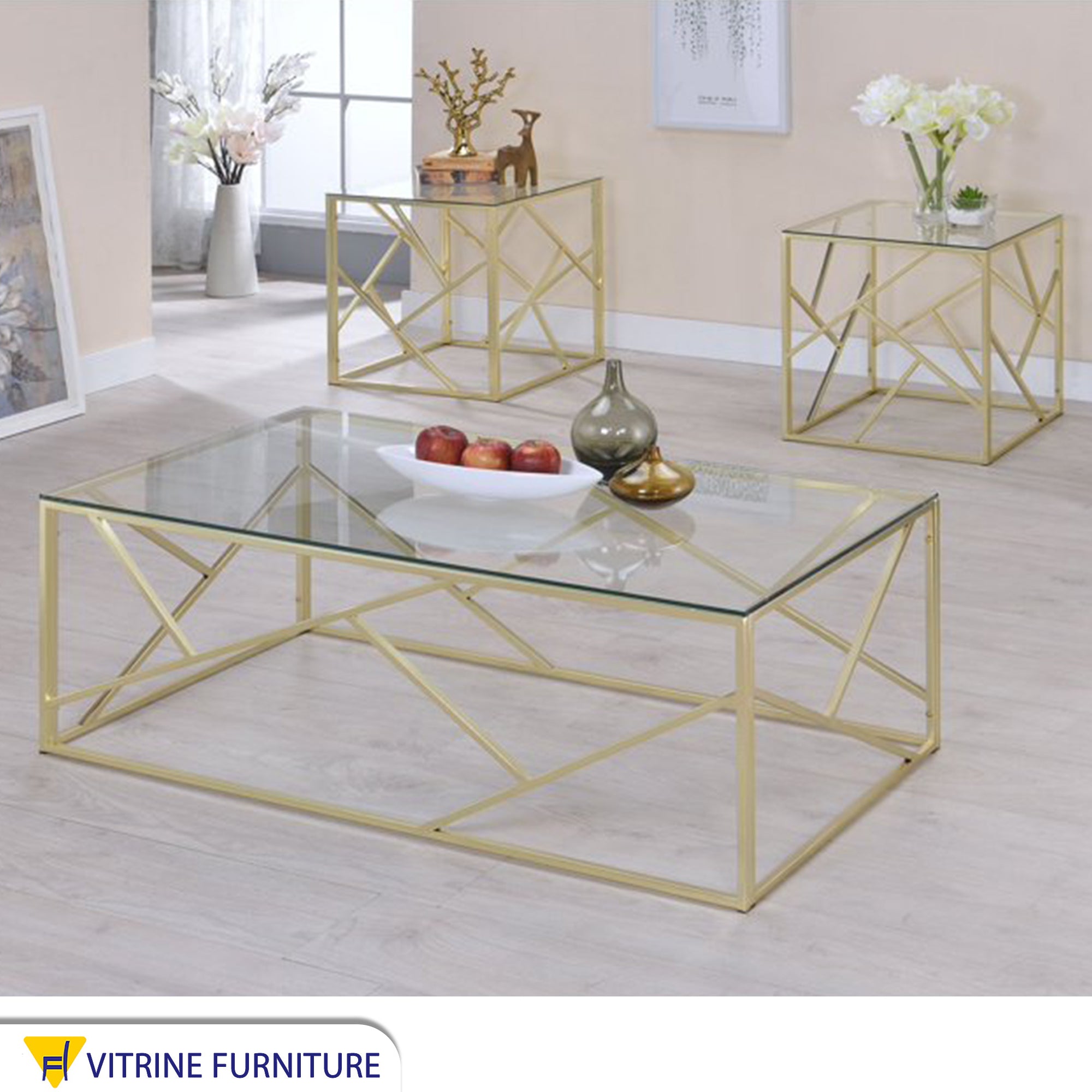 A set of tables in gold with a modern design