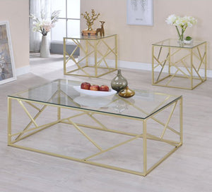 A set of tables in gold with a modern design