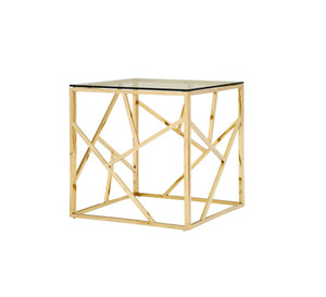 A set of tables in gold with a modern design