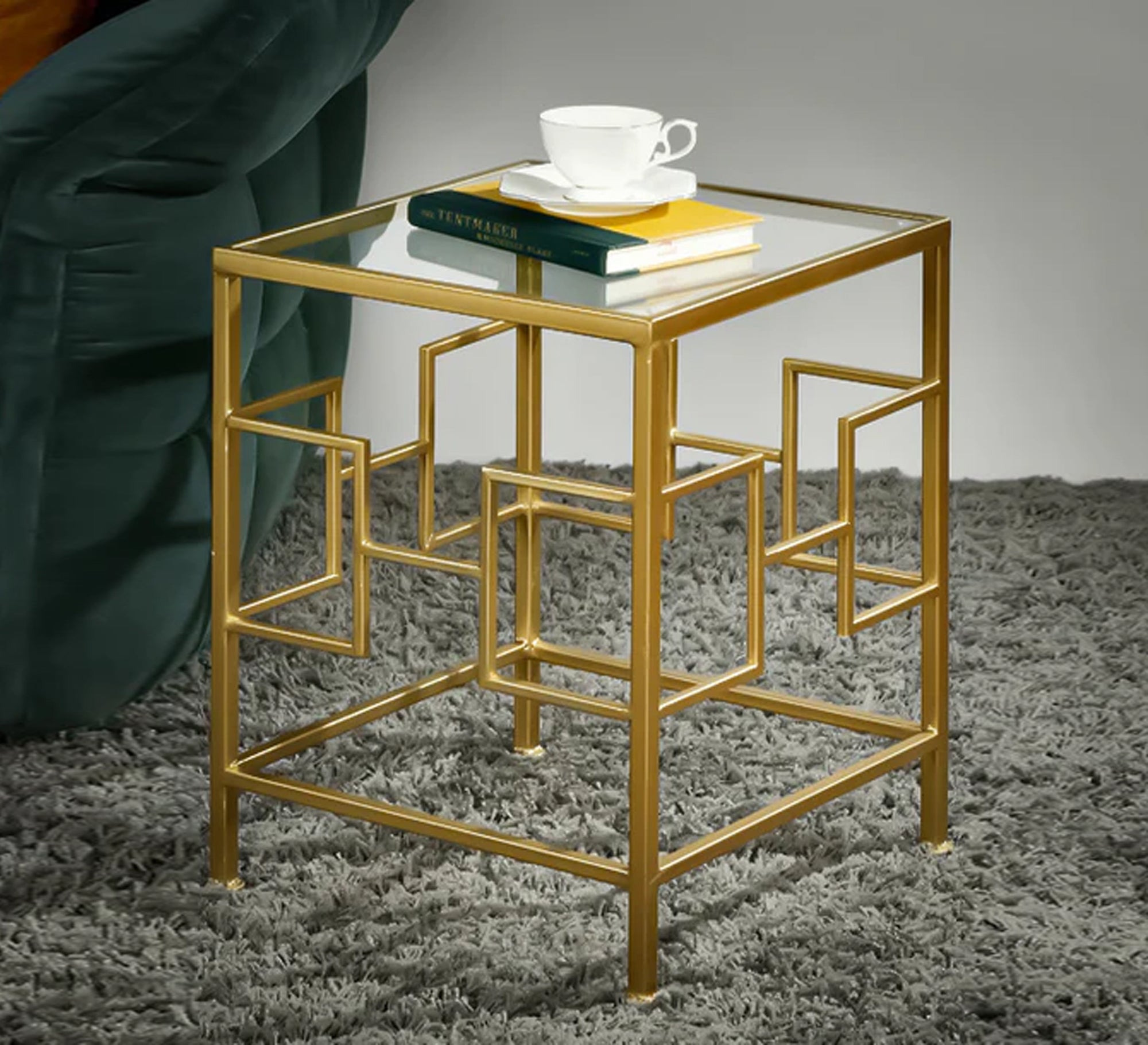 Square table with decorative metal frame