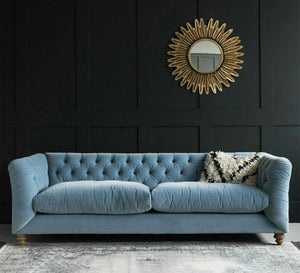 Blue sofa with capitone beads