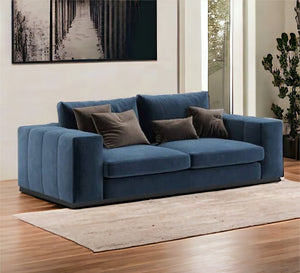 A sofa with recessed lines and armrests