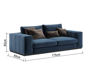 A sofa with recessed lines and armrests