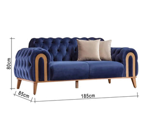 A navy blue sofa with caputin beads