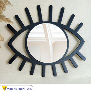 Mirror with eye-shaped frame