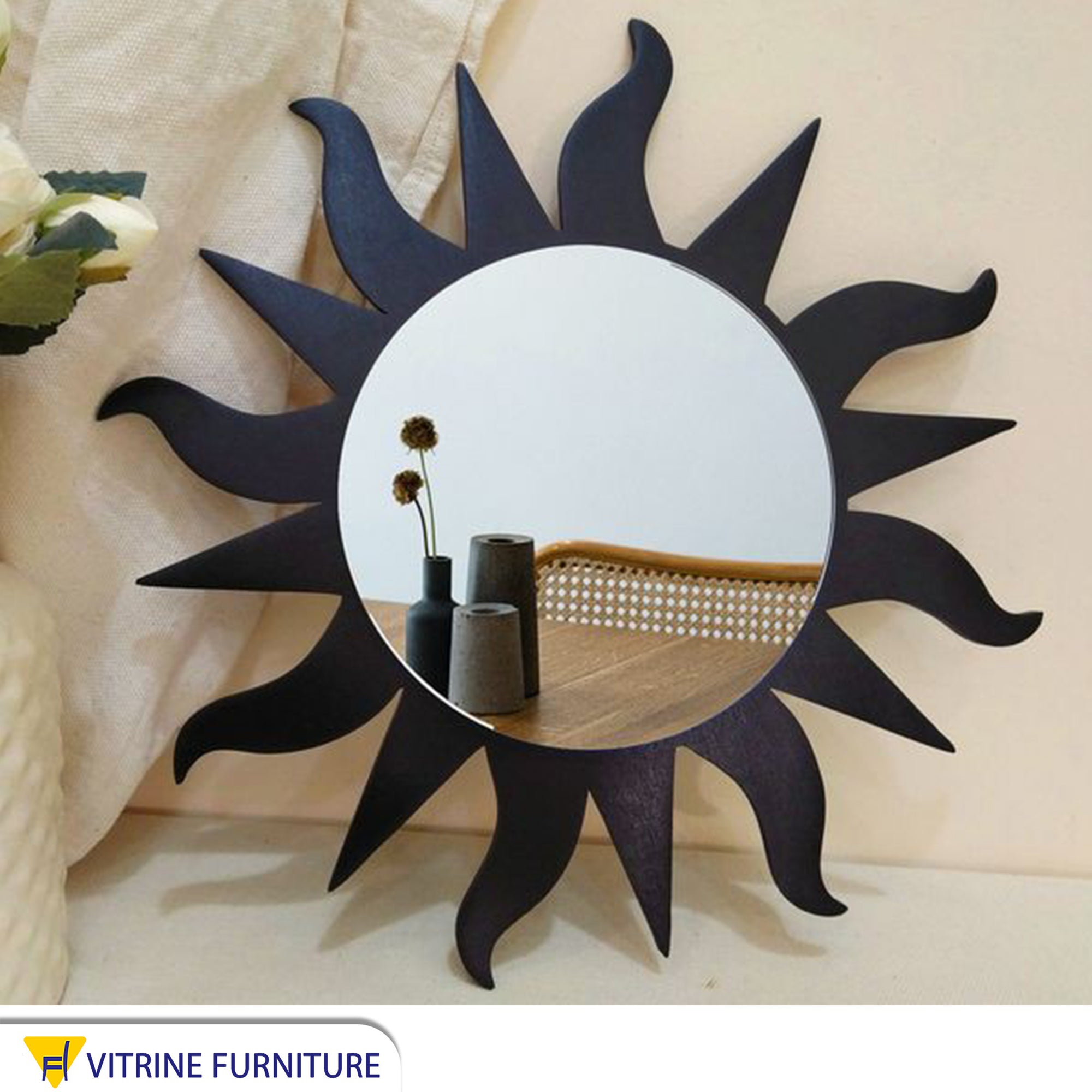 A mirror shaped like a sun and its rays