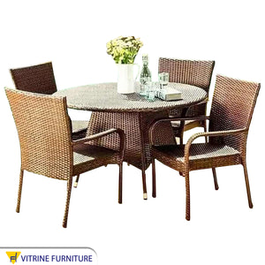 Circular dining table with four chairs