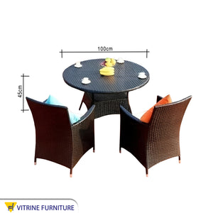 Circular rattan table with eight chairs