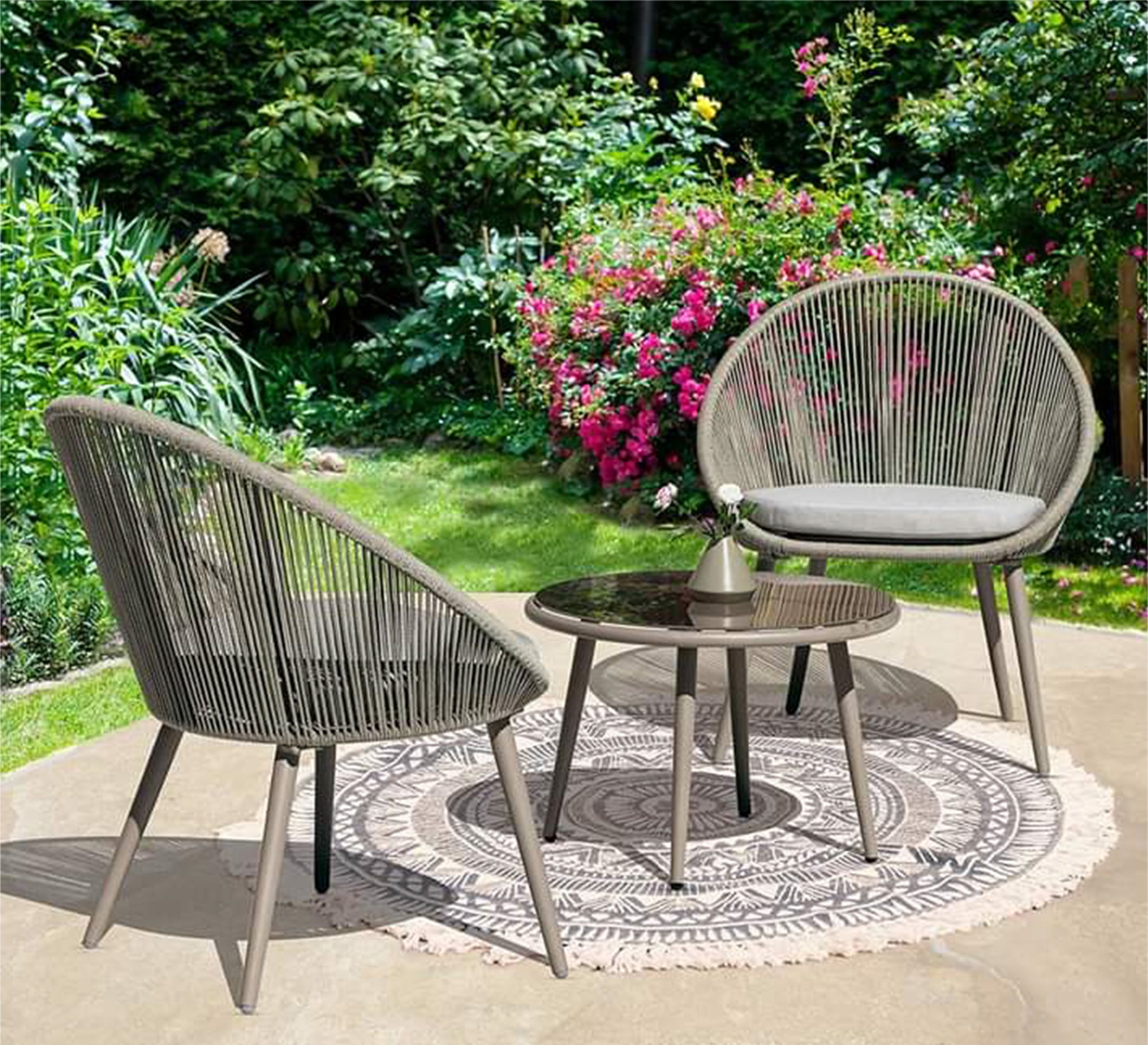 Two beige chairs and a table for the terraces