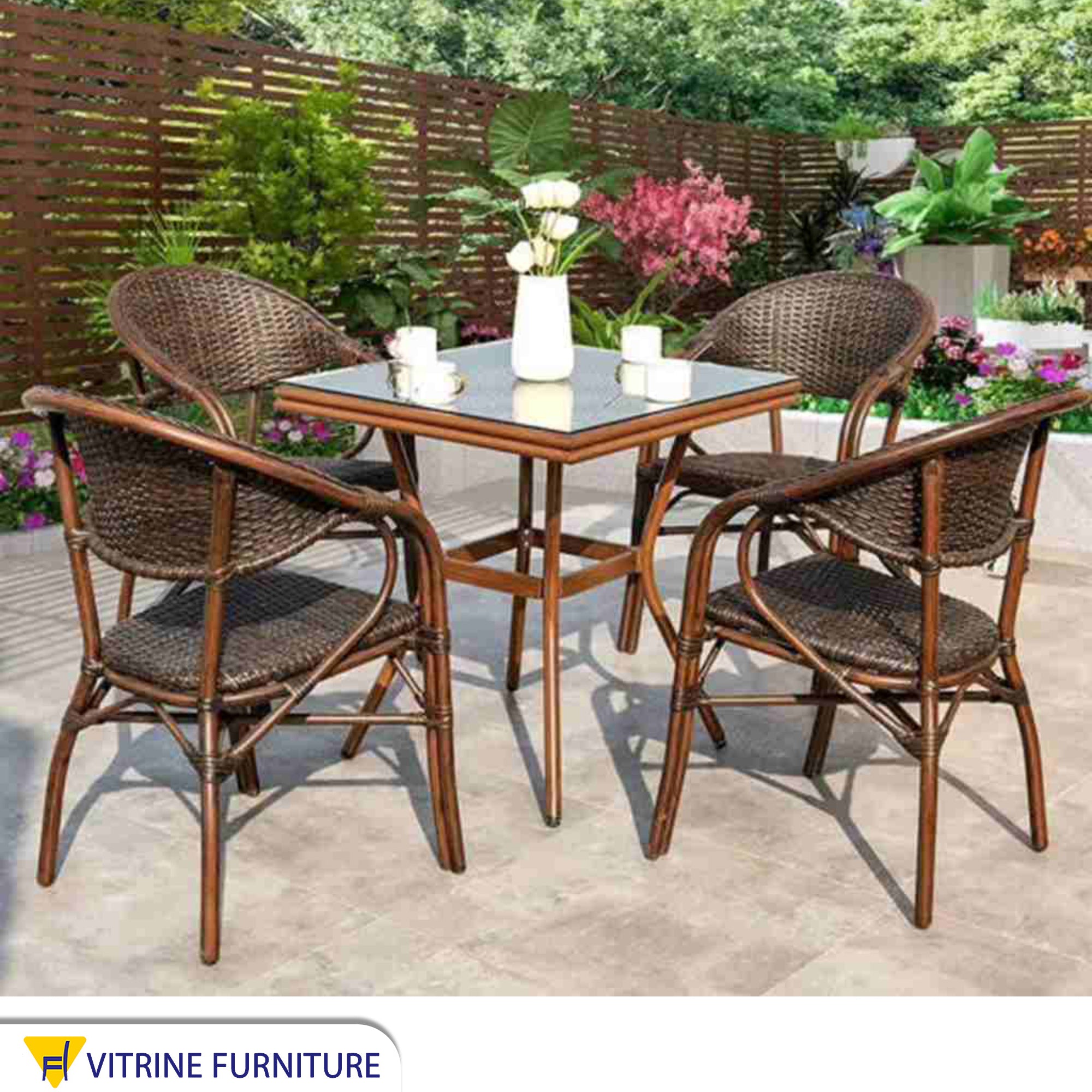 Rattan dining room with a square table with a glass top
