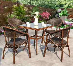 Rattan dining room with a square table with a glass top