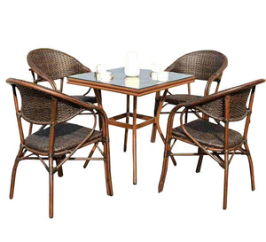 Rattan dining room with a square table with a glass top