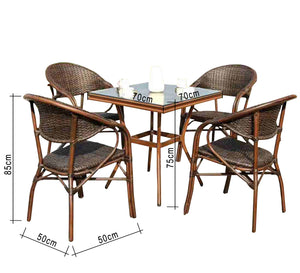 Rattan dining room with a square table with a glass top