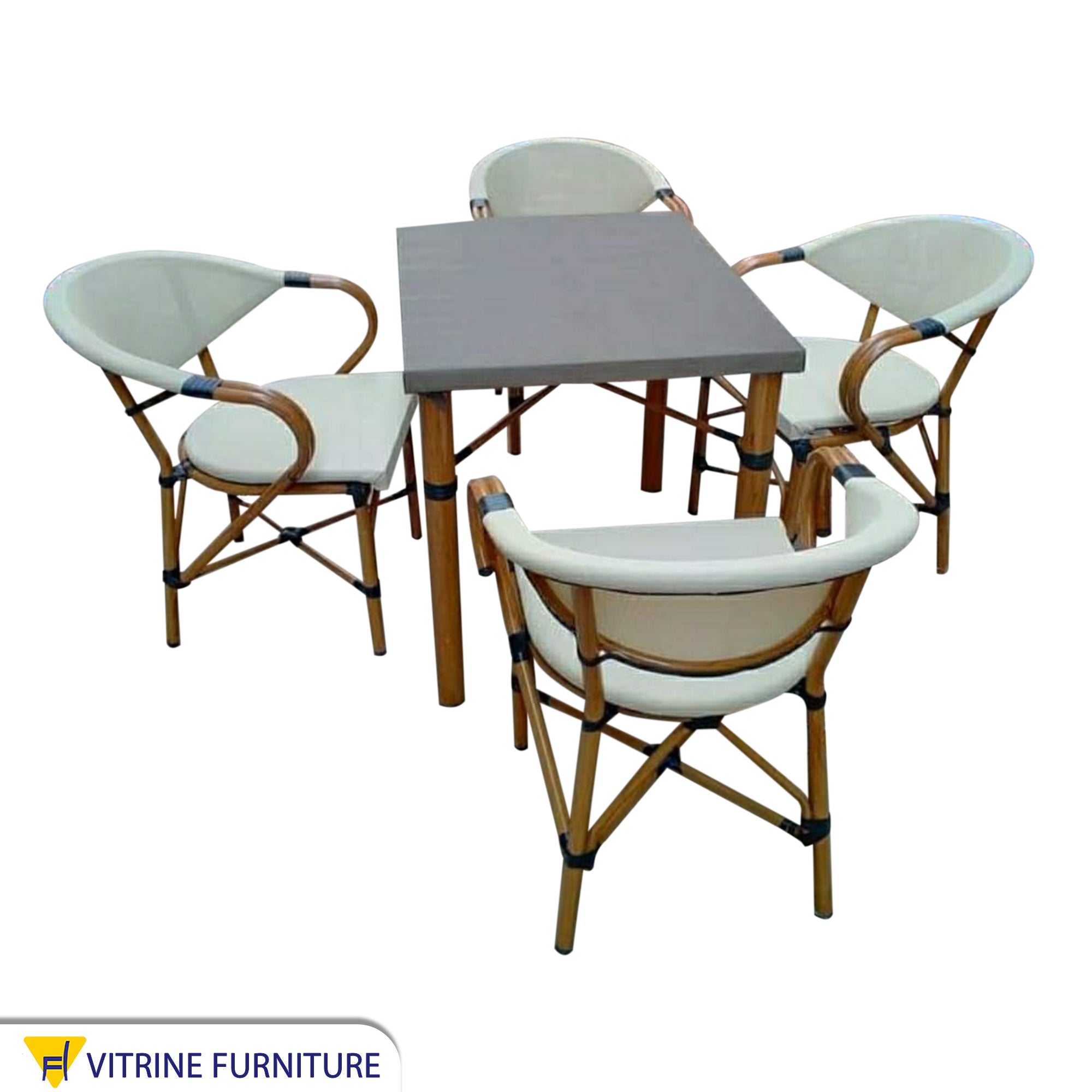 A small dining table with four chairs and a table