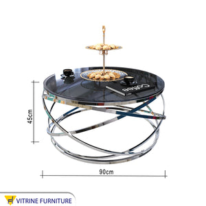 Circular table with silver blown chassis