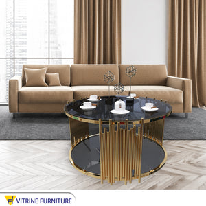 Golden circular table with two living surfaces