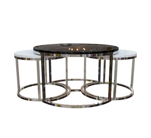 Three silver tables with black and white marble