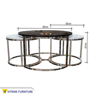 Three silver tables with black and white marble