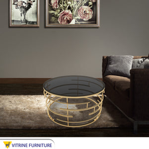 Circular center table with black glass