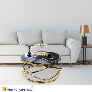 Circular table with golden blown chassis