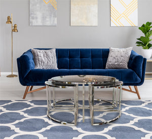 A circular table with four small silver tables