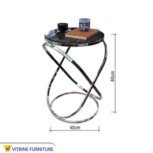 Table with a nested oval steel frame