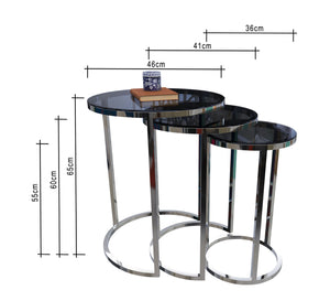 Three delicately designed circular tables