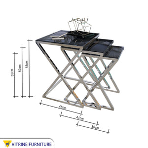 Three silver square tables