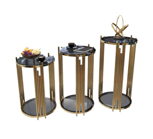 Three circular tables with steel sticks