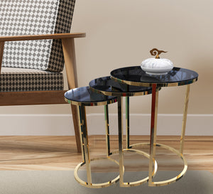 Three stainless steel side tables