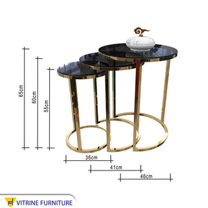 Three stainless steel side tables