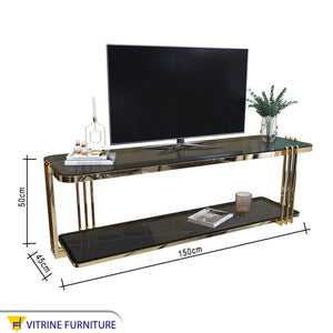 A rectangular gold TV table with two shelves