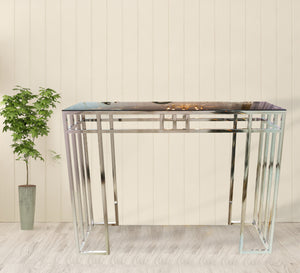 Stainless steel console decorated with successive sticks