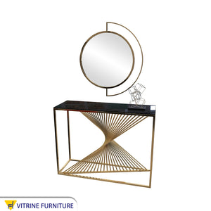 Decorative console and golden circular mirror