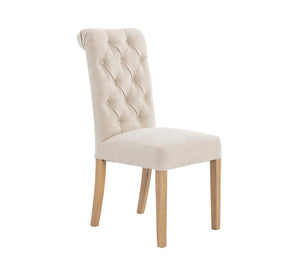 Dining chair with capitone upholstery