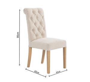 Dining chair with capitone upholstery