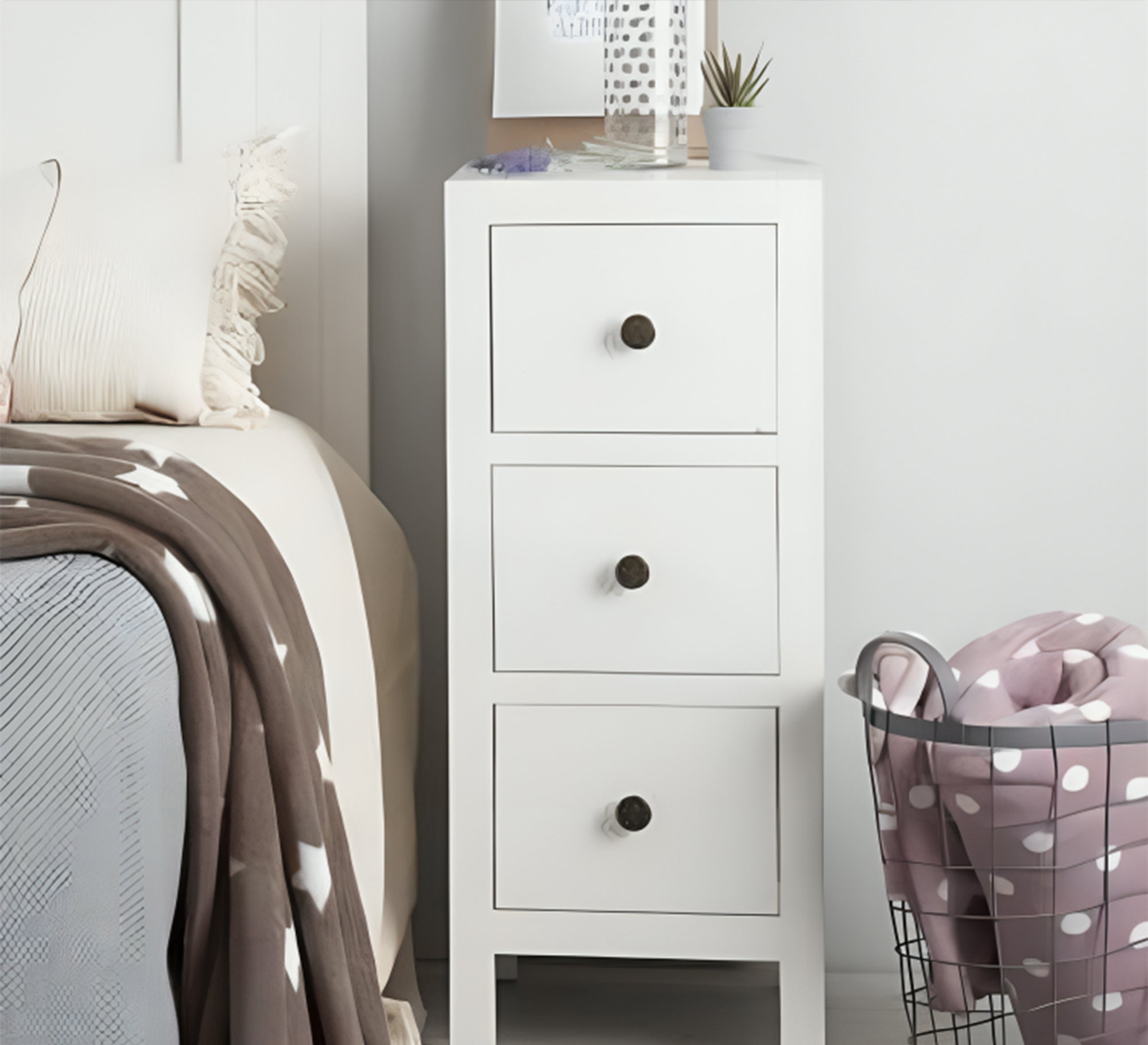 A dresser with 3 drawers on top of each other